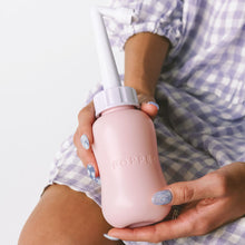 Load image into Gallery viewer, New mom holds Popped pink postpartum peri bottle