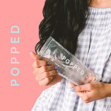 Load image into Gallery viewer, Woman holds a reusable hot and cold pack