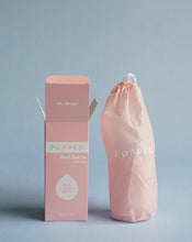 Load image into Gallery viewer, Popped Peri Bottle is inside a travel-friendly storage bag. To the left of that is the packaging, which reads, &quot;Hi, Mom! Popped Peri Bottle&quot;. Pictured on blue background.
