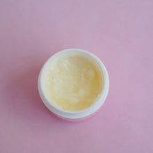 Load image into Gallery viewer, Jar of Organic Nipple Balm with no lid is shown from a top-down view. The balm appear smooth and yellow.
