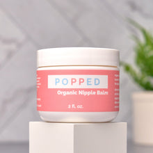 Load image into Gallery viewer, Popped Organic Nipple Balm jar sits on display
