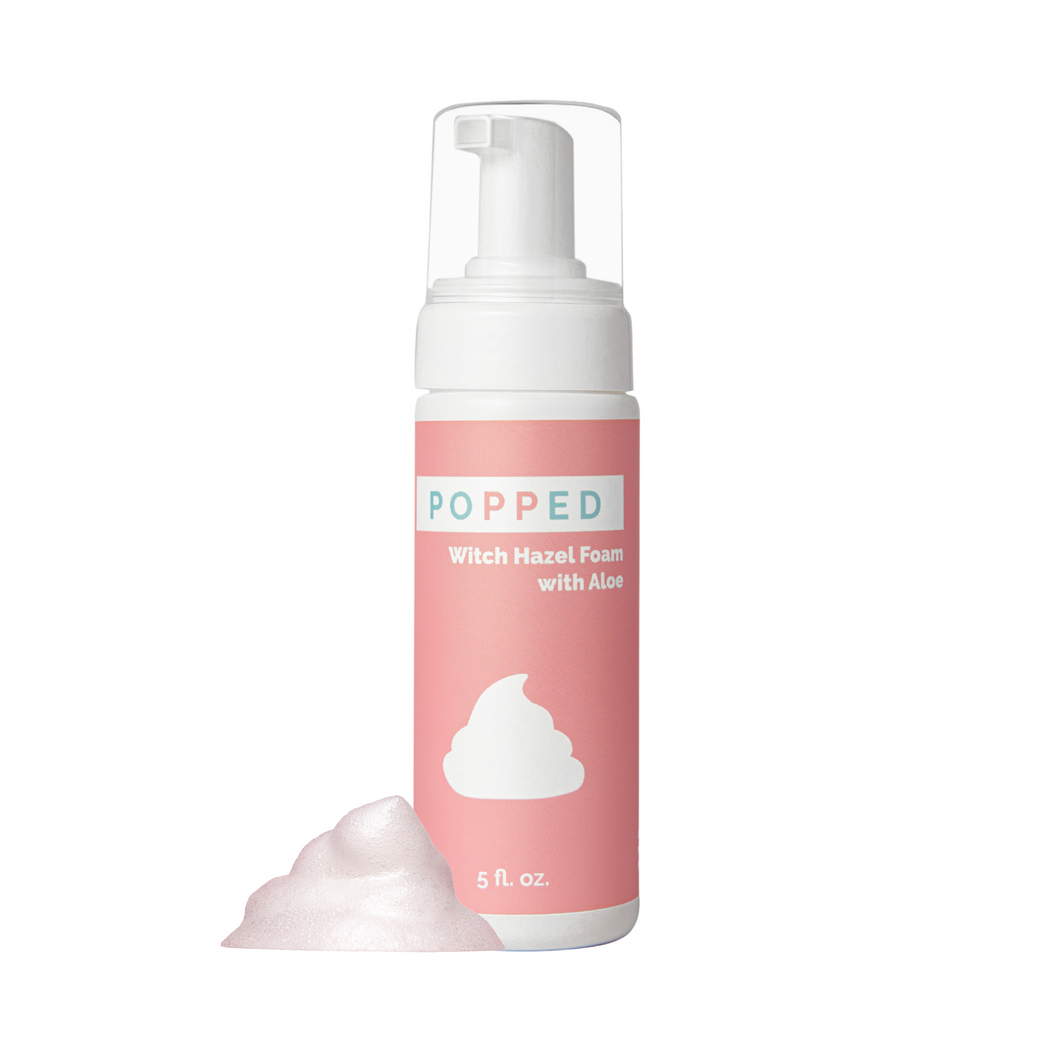 A pump bottle of Popped Witch Hazel Foam with Aloe, 5 fl oz size, with a pink label and a cloud of foam visible in front.