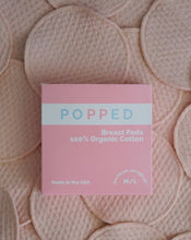 Load image into Gallery viewer, Popped organic cotton biodegradable breast pad box on breast pads.
